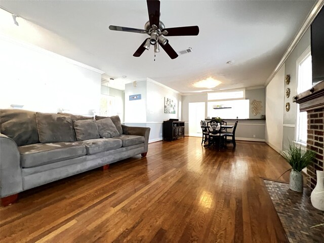 1929 W Dallas St, Houston, TX 77019 - living area with ornamental molding, wood finished floors, a ceiling fan, plenty of natural light, and baseboards