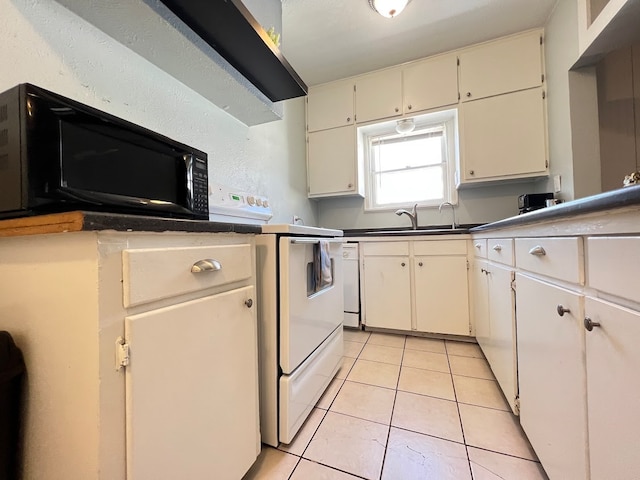 kitchen featuring light tile patterned flooring, sink, and white appliances