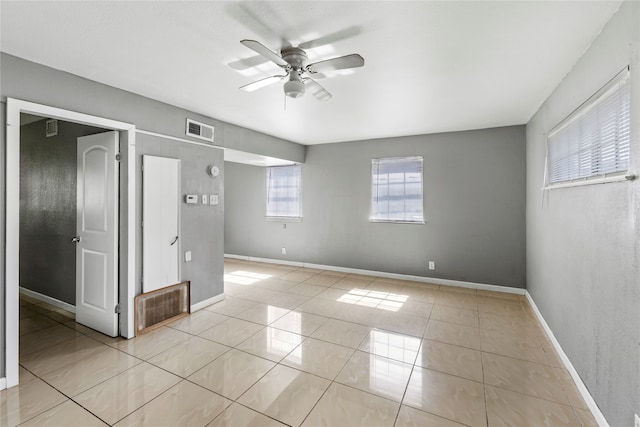 unfurnished bedroom featuring light tile patterned flooring and ceiling fan