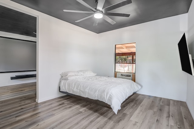 bedroom featuring ceiling fan and wood-type flooring