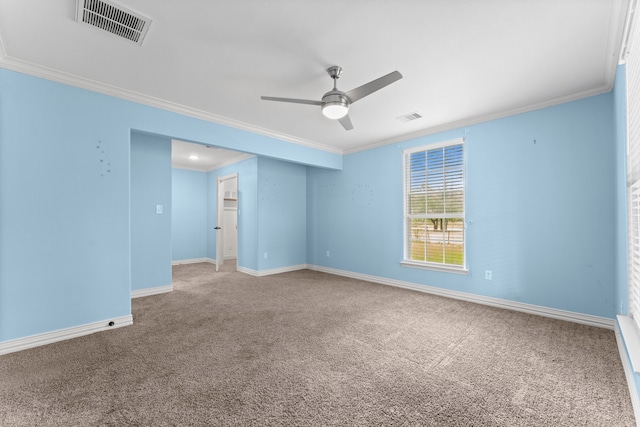 carpeted spare room featuring ornamental molding and ceiling fan