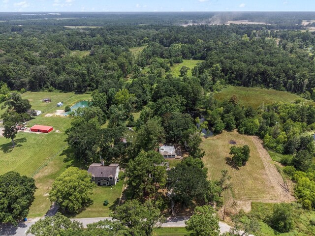 birds eye view of property featuring a water view and a rural view