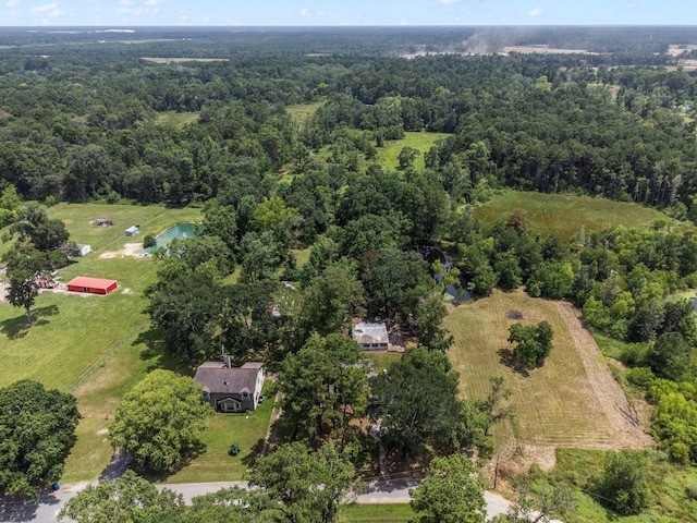 bird's eye view featuring a forest view