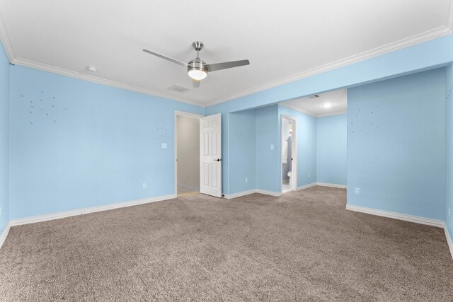 carpeted spare room featuring ceiling fan and ornamental molding