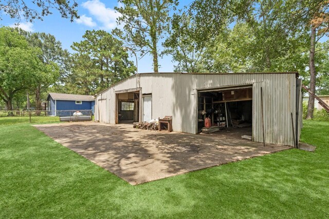 view of outdoor structure featuring a lawn