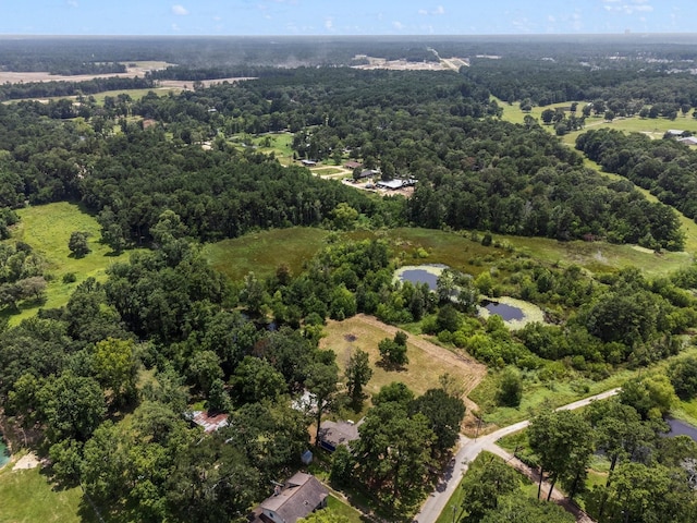 aerial view featuring a view of trees