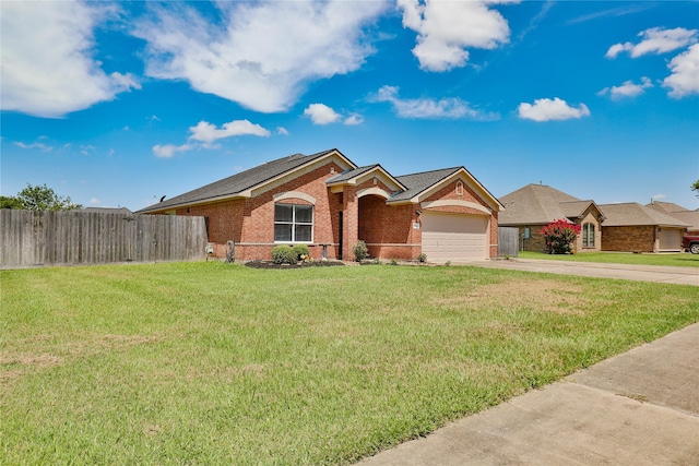 ranch-style home with a garage and a front yard