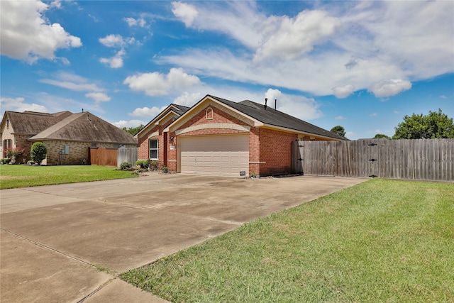 single story home featuring a garage and a front lawn