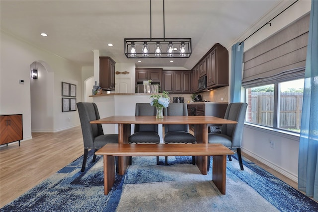 dining area with light hardwood / wood-style floors