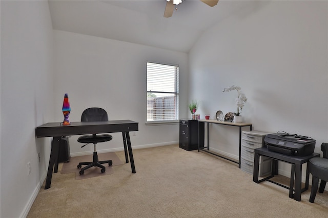 office featuring vaulted ceiling, ceiling fan, and light colored carpet