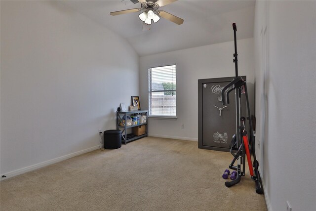 exercise room with ceiling fan, light colored carpet, and lofted ceiling