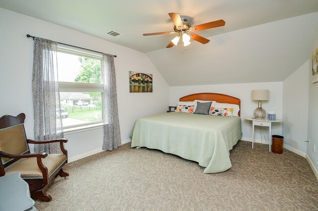 bedroom featuring lofted ceiling, carpet floors, and ceiling fan