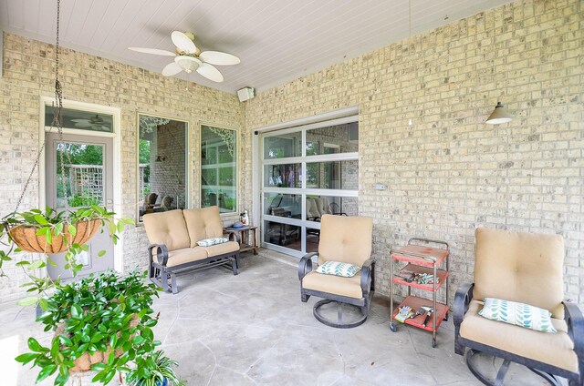 view of patio / terrace with ceiling fan and outdoor lounge area