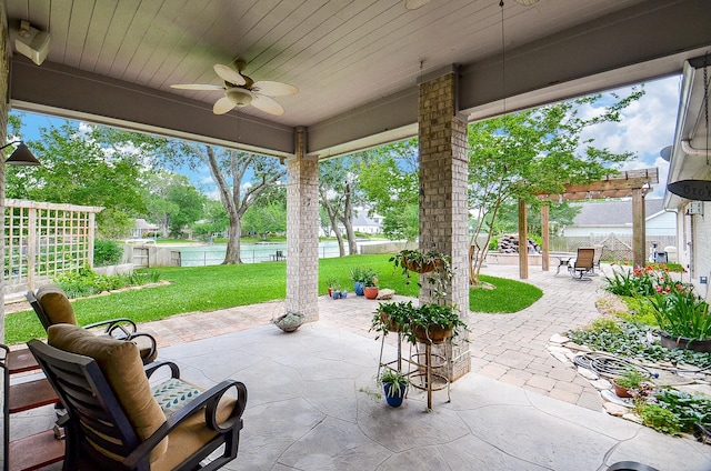 view of patio / terrace featuring ceiling fan and a pergola