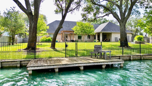 dock area featuring a yard and a water view