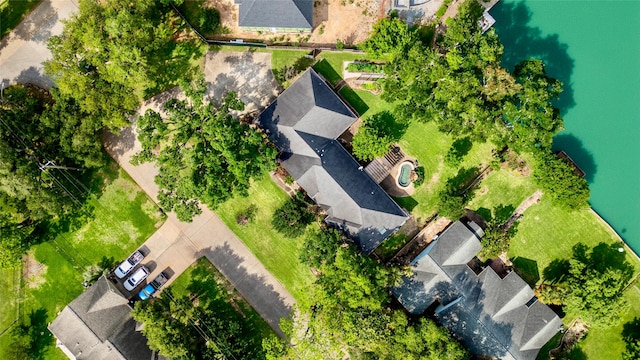 birds eye view of property with a water view