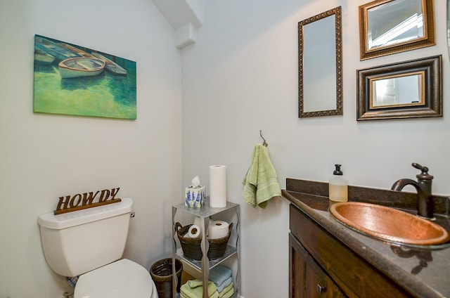 half bath with vanity and toilet