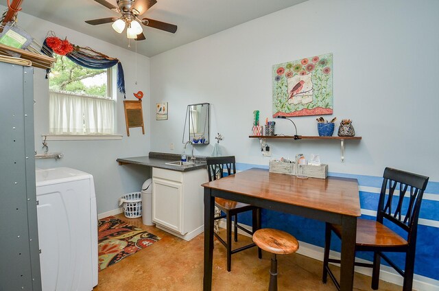 interior space featuring ceiling fan and washer / clothes dryer