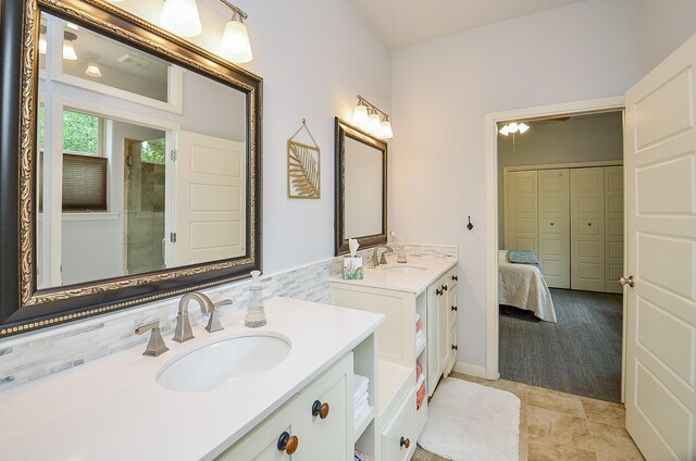 bathroom with vanity and decorative backsplash