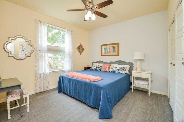 bedroom featuring carpet flooring, ceiling fan, and a closet