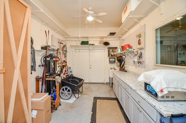 interior space with ceiling fan