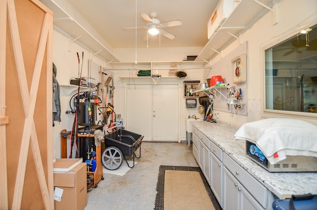 interior space with ceiling fan