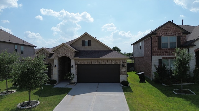 view of front of house featuring a garage and a front lawn