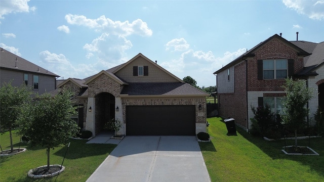 view of front of property featuring a garage and a front yard