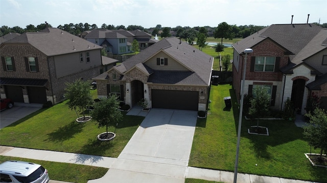 view of front of property with a garage and a front yard