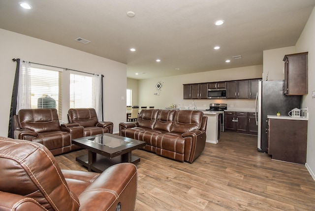 living room with light hardwood / wood-style floors