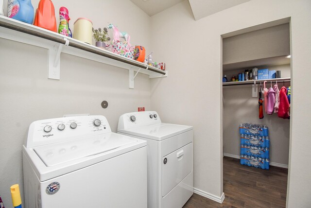 laundry area with dark hardwood / wood-style flooring and separate washer and dryer