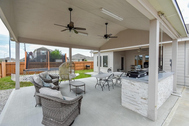 view of patio / terrace featuring an outdoor bar and a trampoline