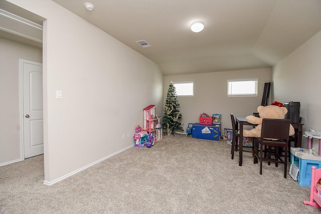 rec room with light colored carpet and vaulted ceiling