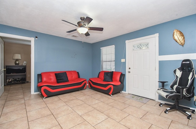 sitting room featuring ceiling fan and light tile patterned floors