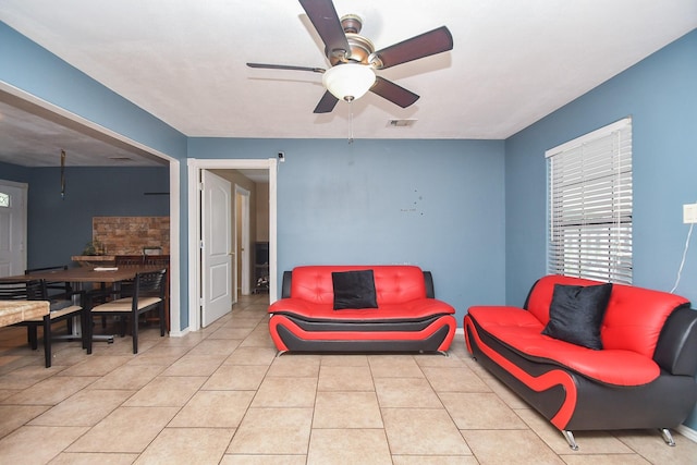 living room featuring ceiling fan and light tile patterned flooring