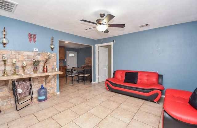 living room with light tile patterned floors and ceiling fan