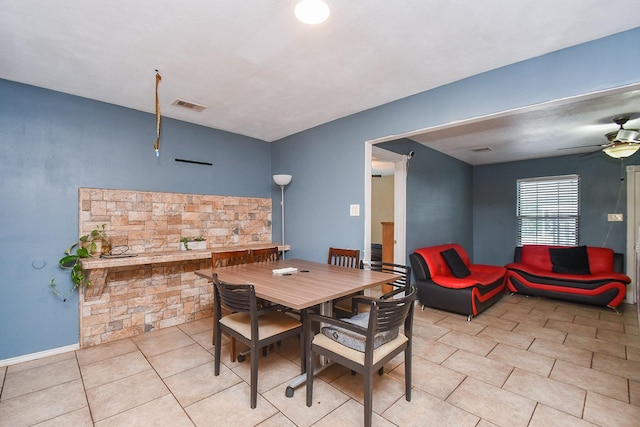 dining space with ceiling fan