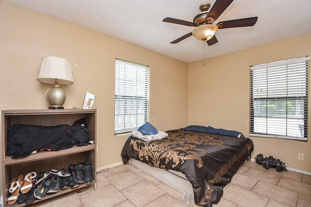 bedroom featuring ceiling fan and light tile patterned flooring