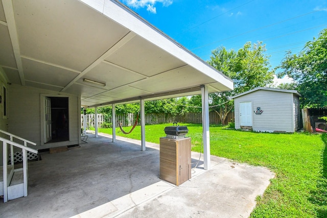 view of patio featuring a storage unit