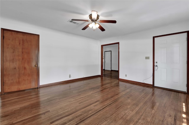 empty room featuring dark hardwood / wood-style floors and ceiling fan