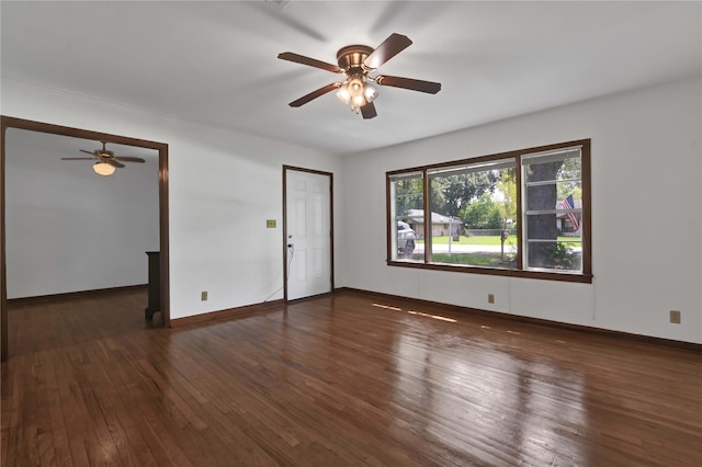 unfurnished room featuring ceiling fan and dark hardwood / wood-style flooring