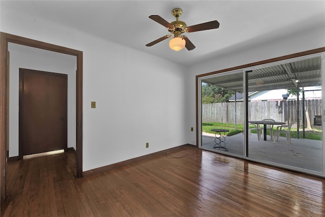 unfurnished room featuring dark wood-type flooring and ceiling fan