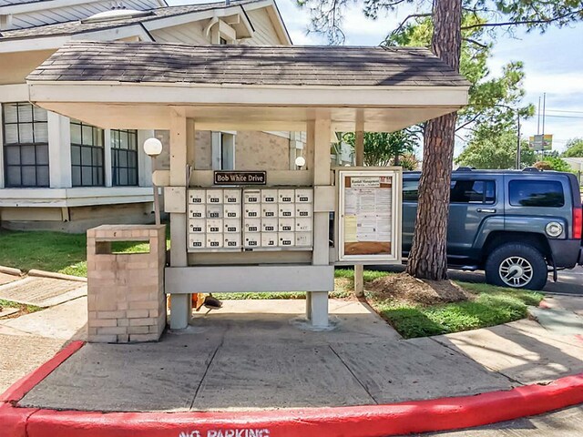 view of home's community with a mail area