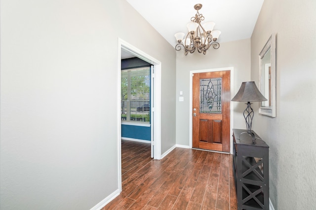 foyer featuring a notable chandelier and dark hardwood / wood-style flooring