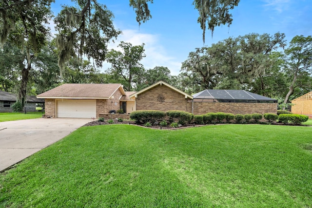 ranch-style home featuring a garage and a front lawn