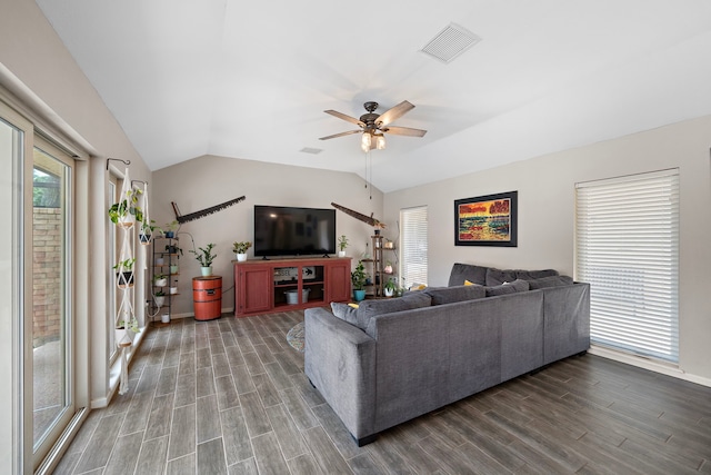 living room featuring hardwood / wood-style flooring, lofted ceiling, and ceiling fan