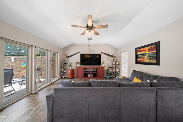 living room with ceiling fan, hardwood / wood-style flooring, and vaulted ceiling