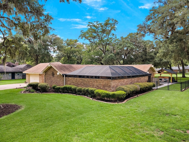 exterior space featuring a garage and a front yard