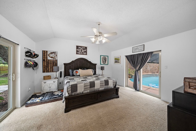 carpeted bedroom with access to exterior, a textured ceiling, ceiling fan, and vaulted ceiling