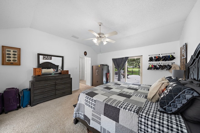 bedroom featuring vaulted ceiling, access to exterior, a textured ceiling, light carpet, and ceiling fan